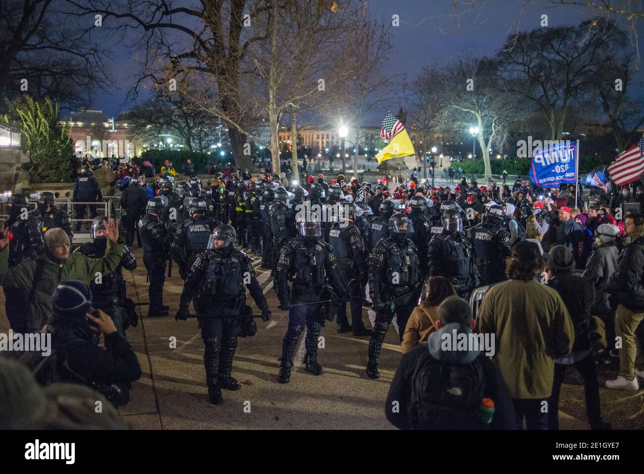 January 6th 2021.Riot Police pushing Pro Trump Supporters out US Capitol grounds to 1st street NW. Washington DC. USA. Stock Photo