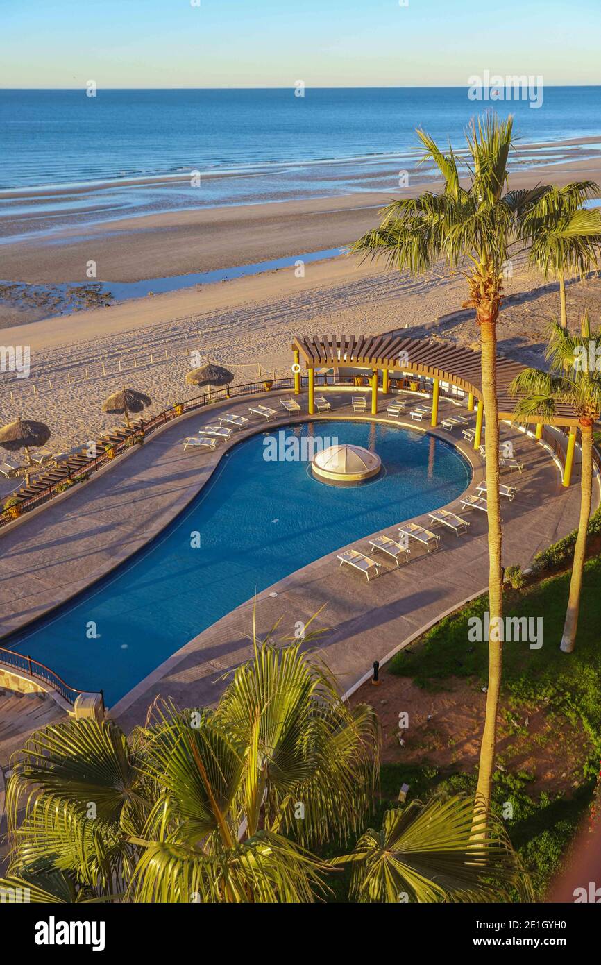 Swimming pool or hotel pool, resor at sunrise in Puerto Peñasco, Sonora,  Mexico Real estate in a tourist and fishing city of Mexico on the Gulf of  California. Sandy Beach, La Choya