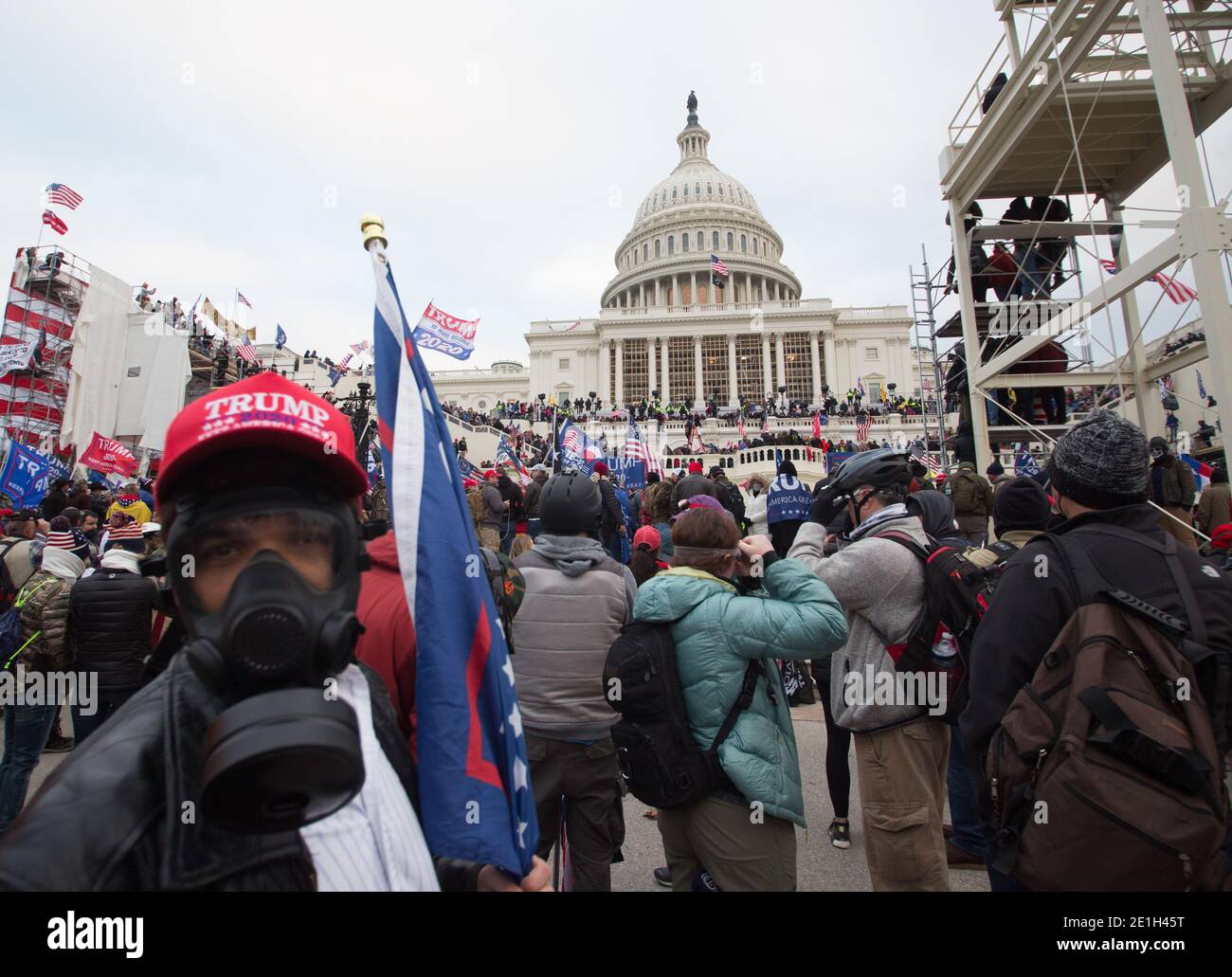 Photos from the January sixth protest at the Capitol building that resulted in 4 deaths. Protestors stormed the innaugural scaffolding and broke into the building despite resistance from officers inside including tear gas. Stock Photo