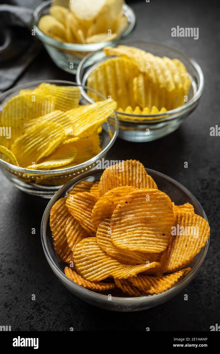 Crispy potato chips with various taste in bowl Stock Photo Alamy