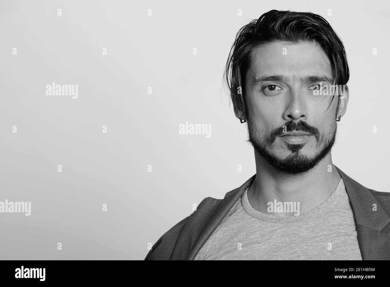 Handsome muscular man looking in Black and White Stock Photos & Images ...