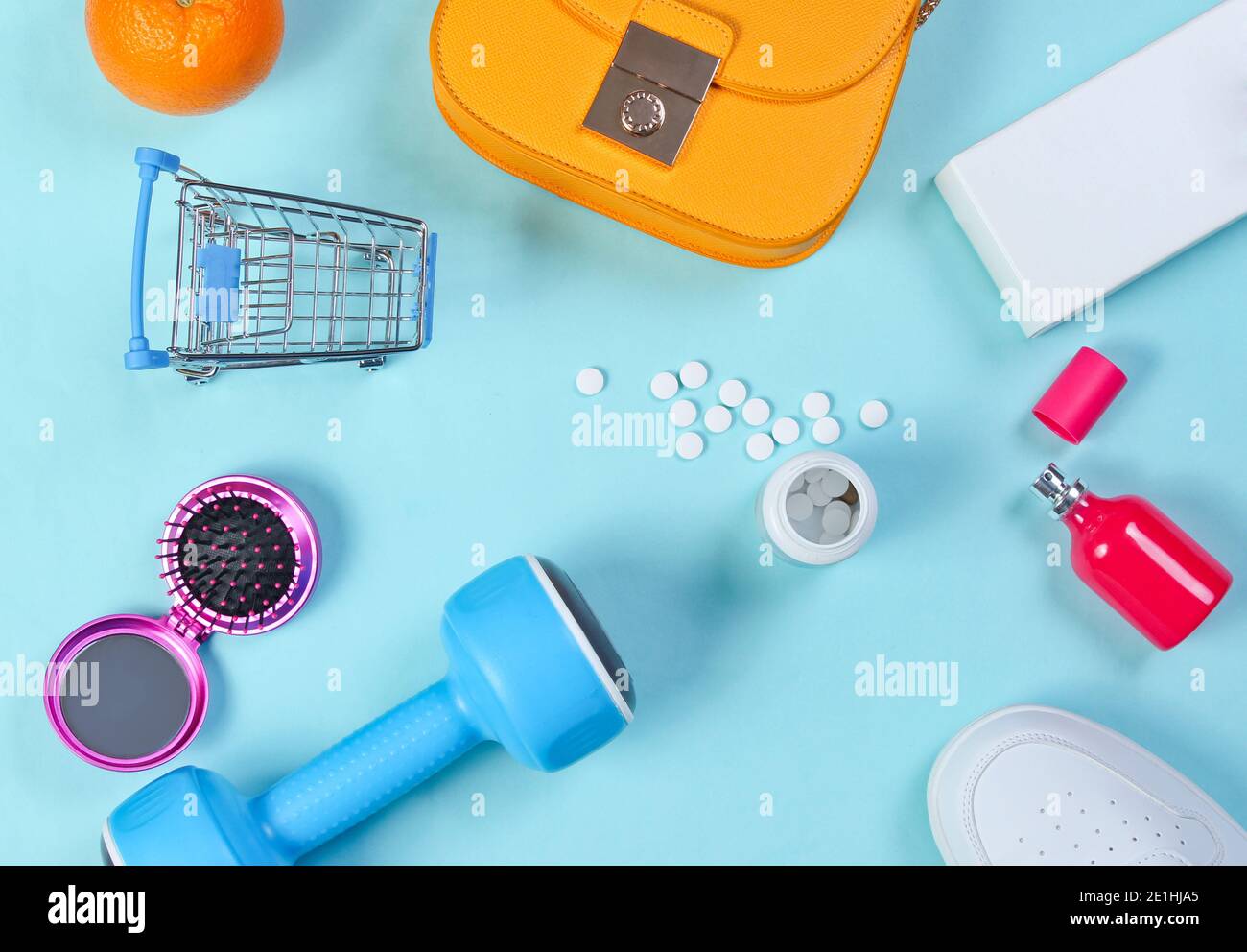Miscellaneous shopping items on blue background. Top view. Stock Photo