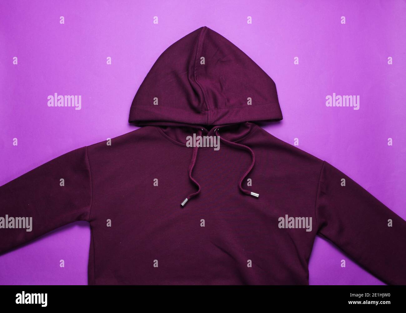 Fashionable hoody on a purple background. Top view Stock Photo