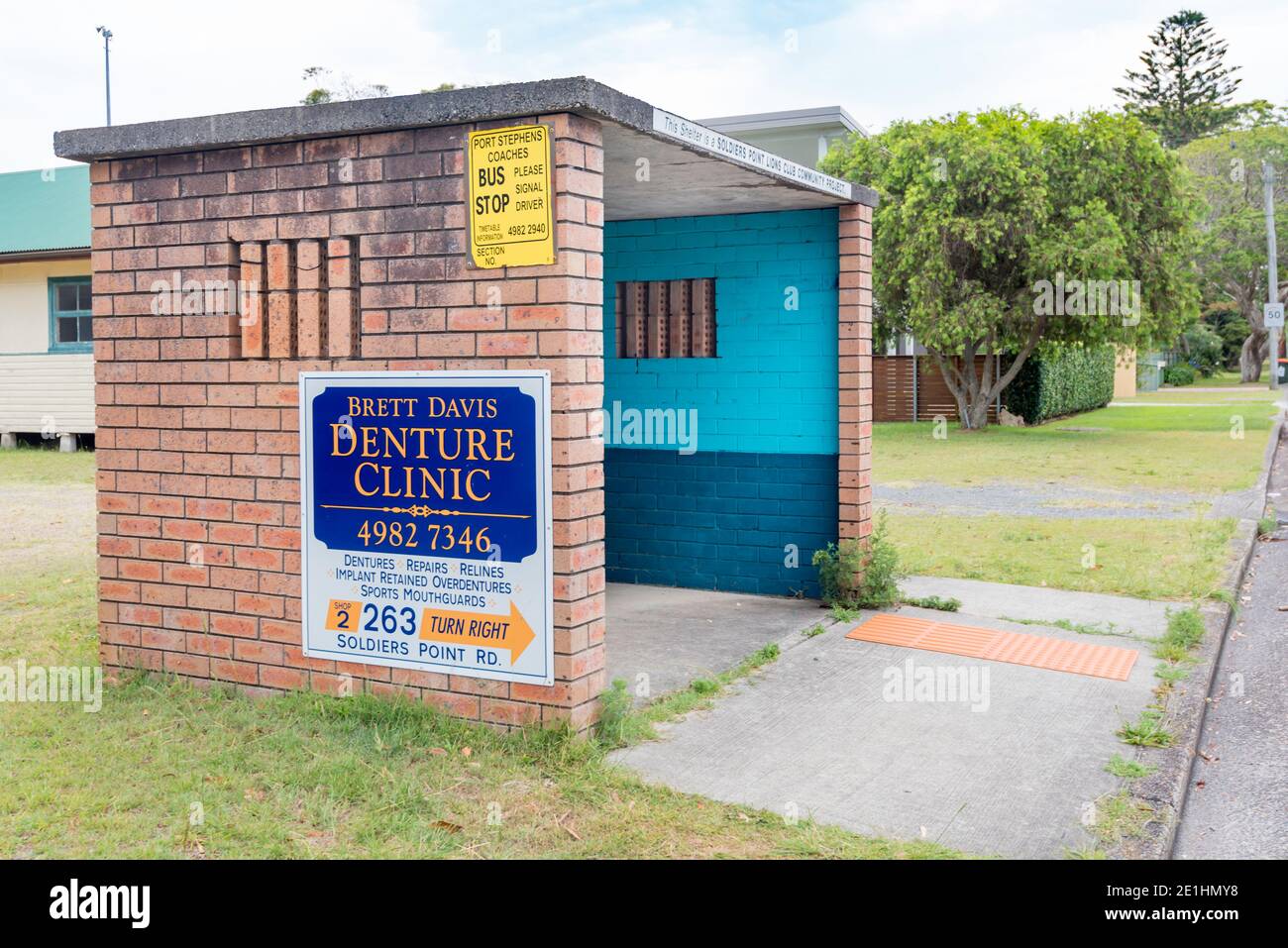 A blonde brick and ash concrete bus shelter built by the Lions Club at Soldiers Point, Port