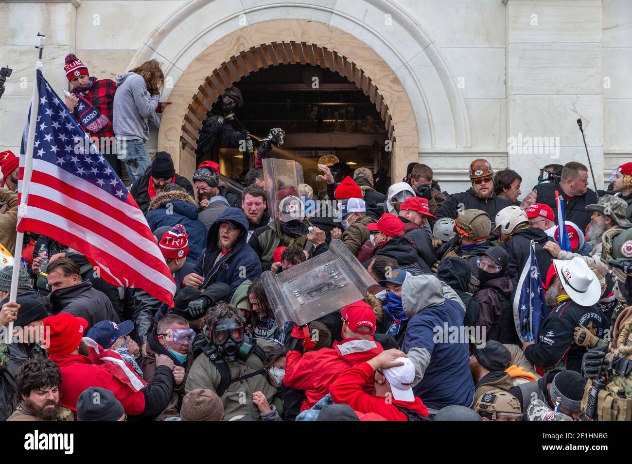 Washington, DC - January 6, 2021: Police use tear gas around Capitol building where pro-Trump supporters riot and breached the Capitol Stock Photo