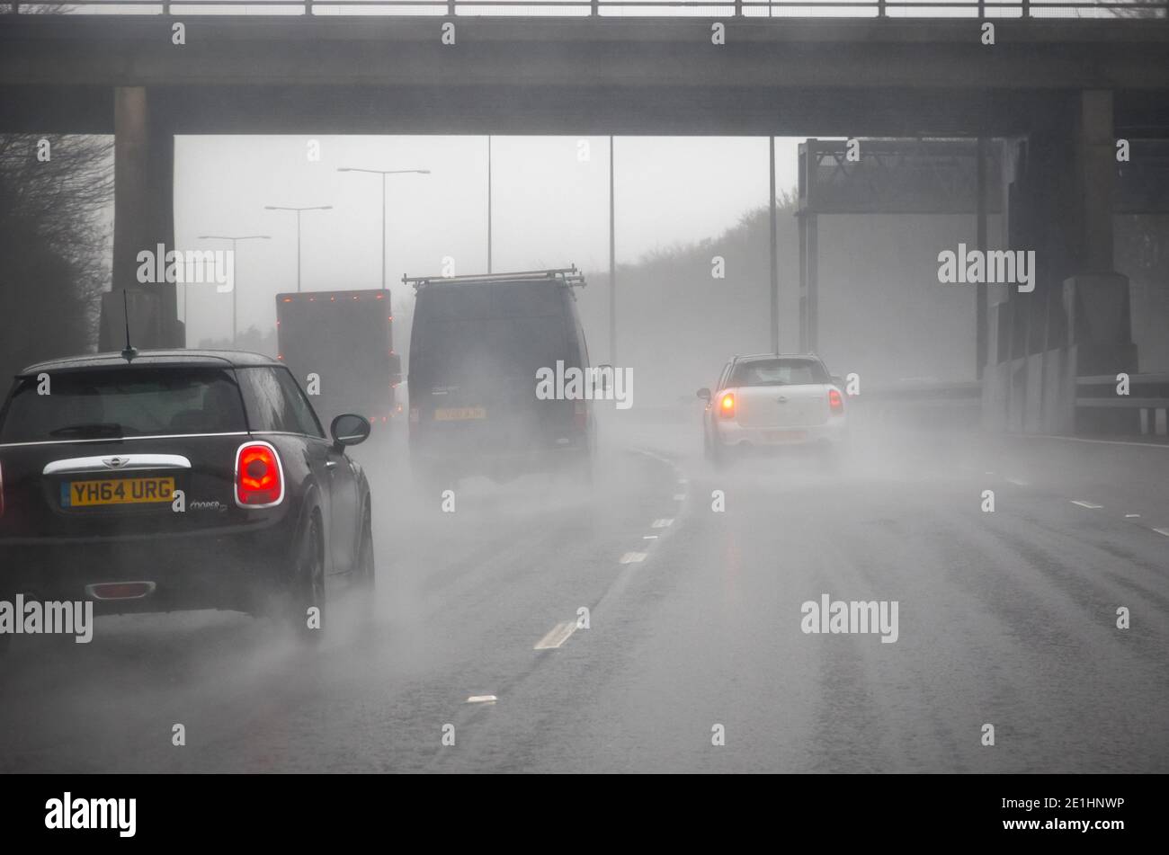 London, UK - April 9, 2019 - Rain on the road, adverse, foggy and rainy driving conditions on the motorway Stock Photo