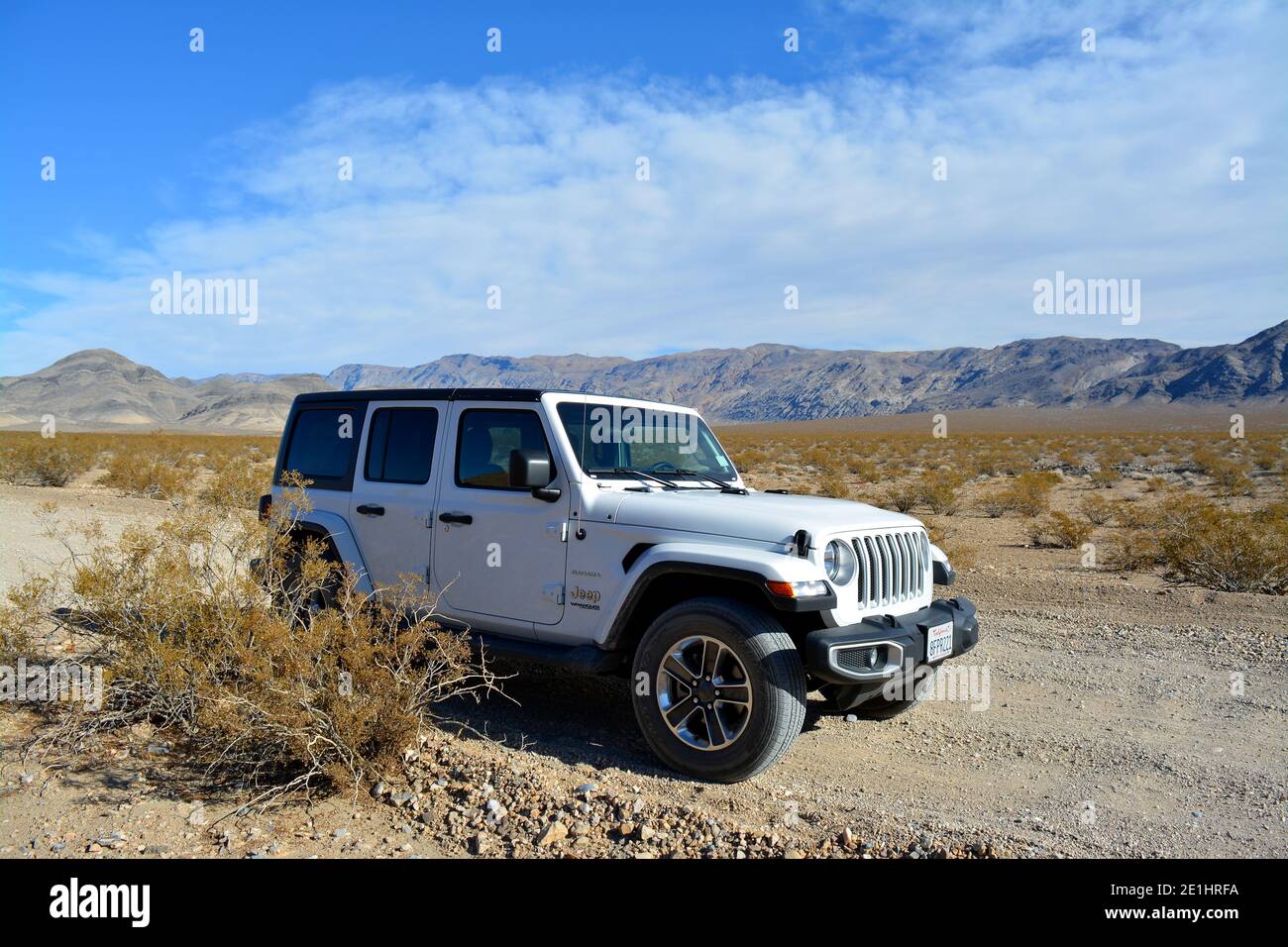 road trip with a white Jeep Wrangler Sahara on a backroad in the desert of  the Death Valley National Park Stock Photo - Alamy