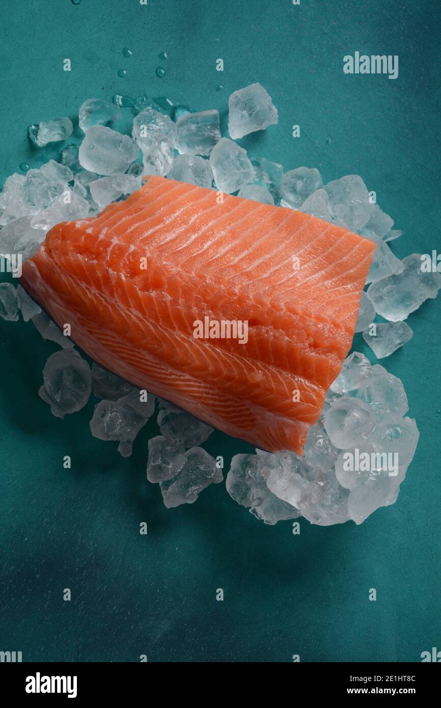 Raw salmon fillet on ice background Stock Photo - Alamy
