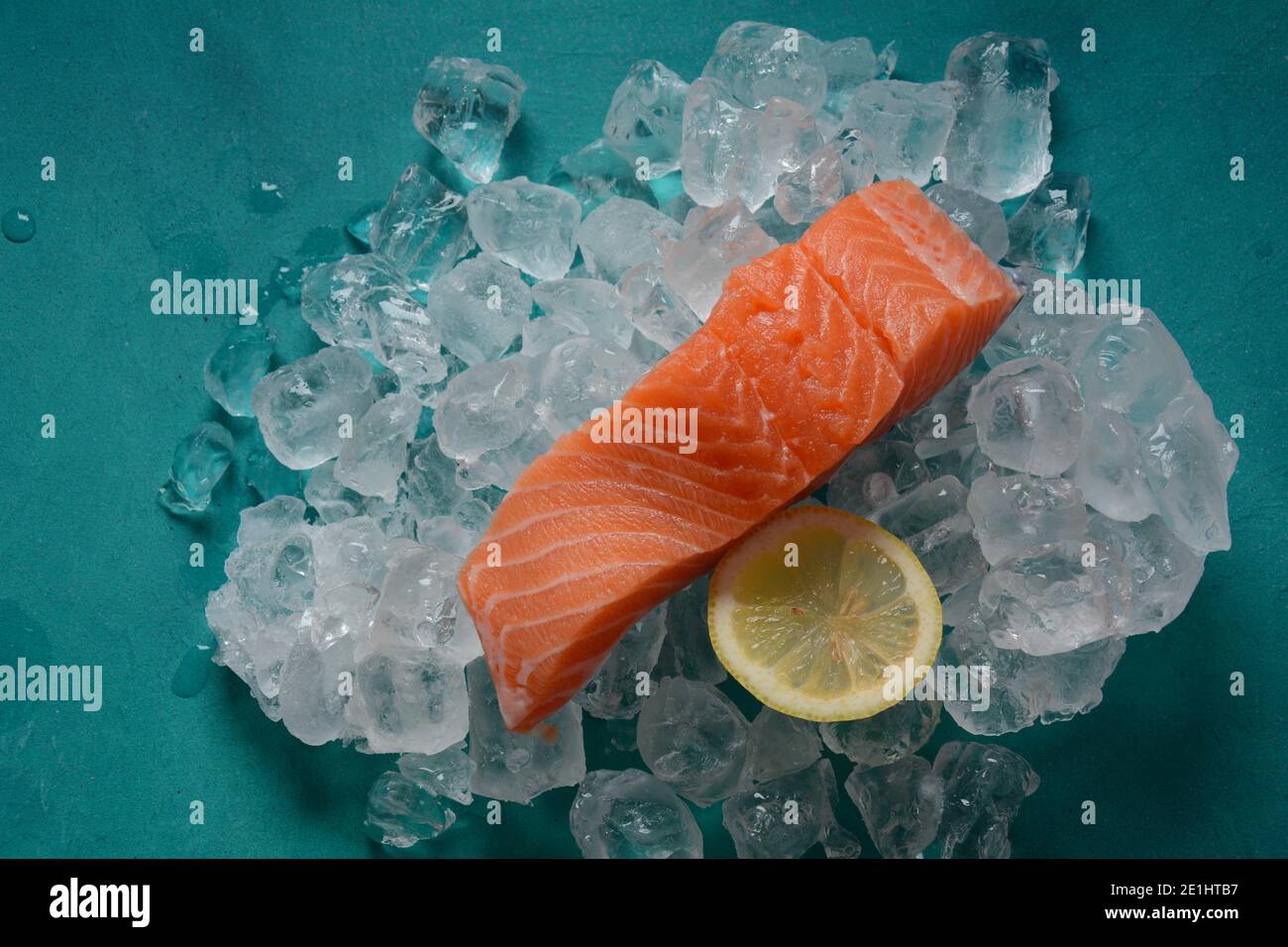 Raw salmon steaks on ice background Stock Photo - Alamy