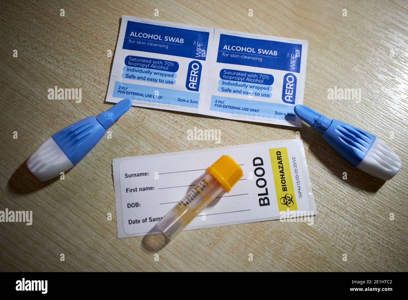 alcohol swabs lancets blood collection tube and label from commercial covid-19 antibody blood test kit for home testing for coronavirus antibodies received in the uk Stock Photo