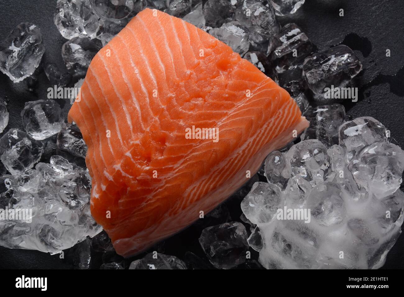 Raw salmon fillet on ice background Stock Photo - Alamy