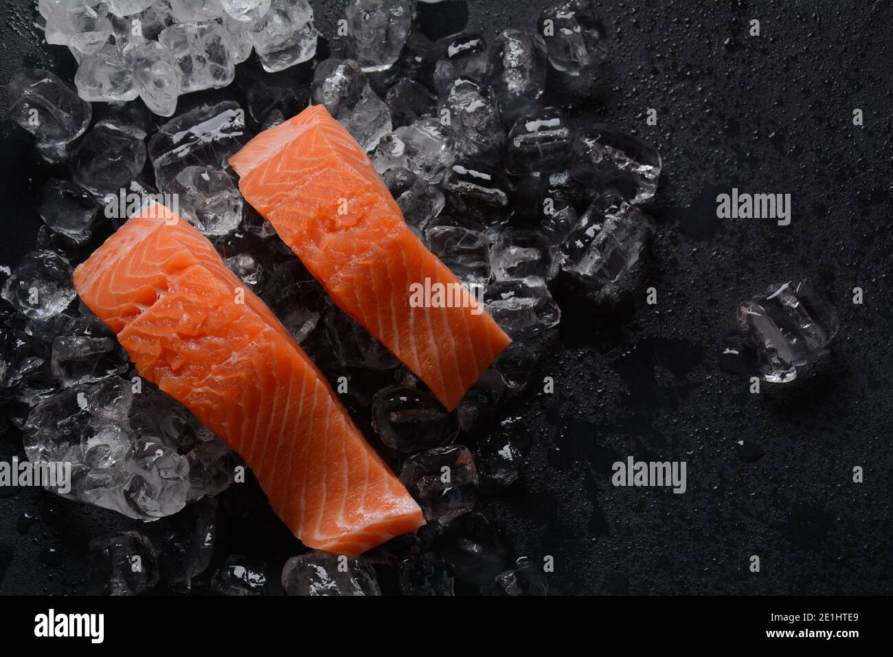 Raw salmon steaks on ice background Stock Photo - Alamy