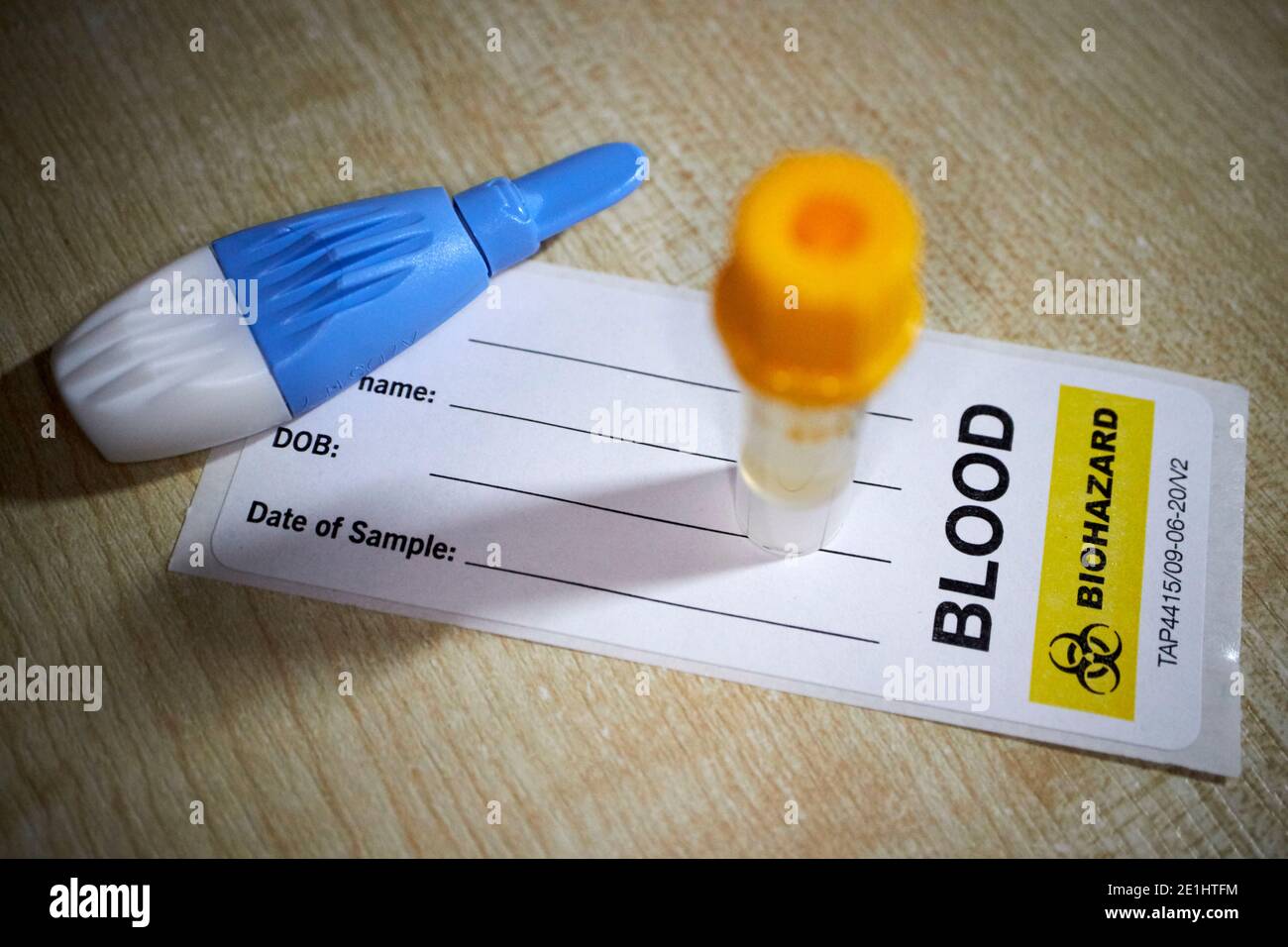 lancet blood collection tube and label from commercial covid-19 antibody blood test kit for home testing for coronavirus antibodies received in the uk Stock Photo