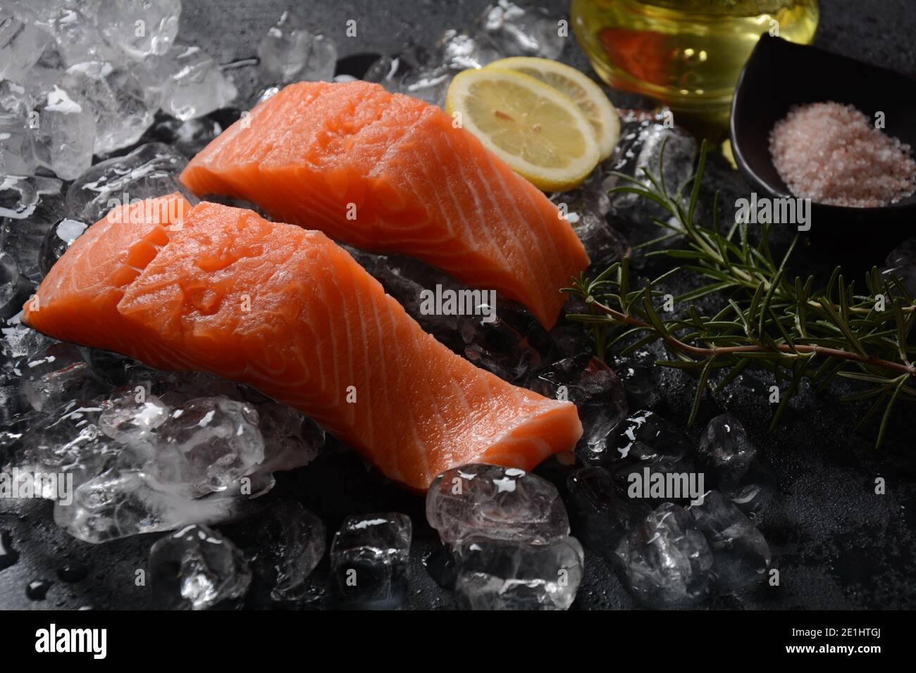 Raw salmon steaks on ice background Stock Photo - Alamy