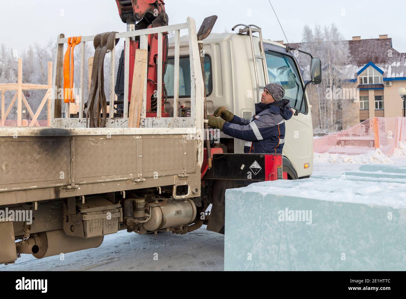 Portrait of a hydraulic crane operator loading ice panels Stock Photo