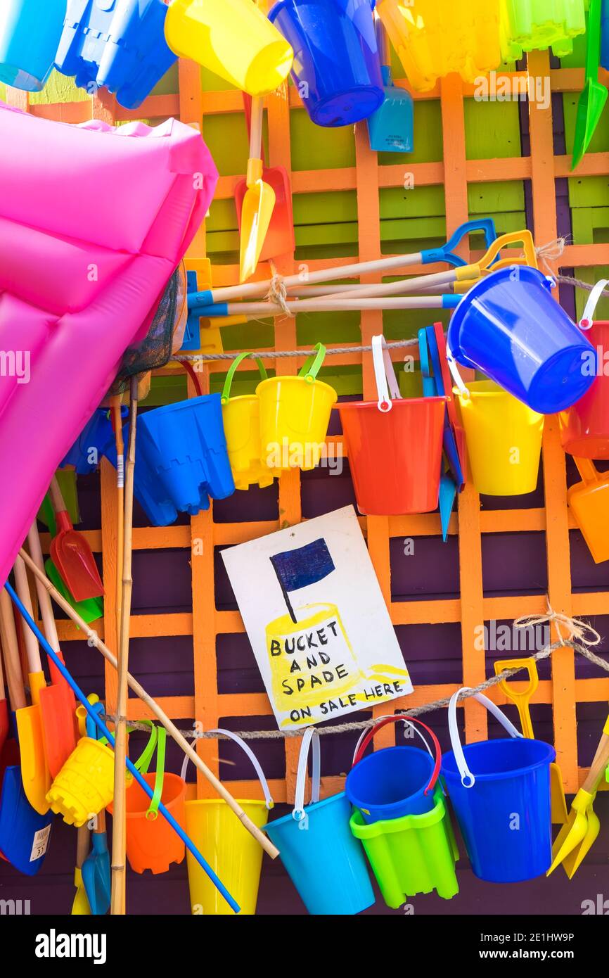 Bucket and spades and other beach items for sale, holiday resort, England Stock Photo Alamy