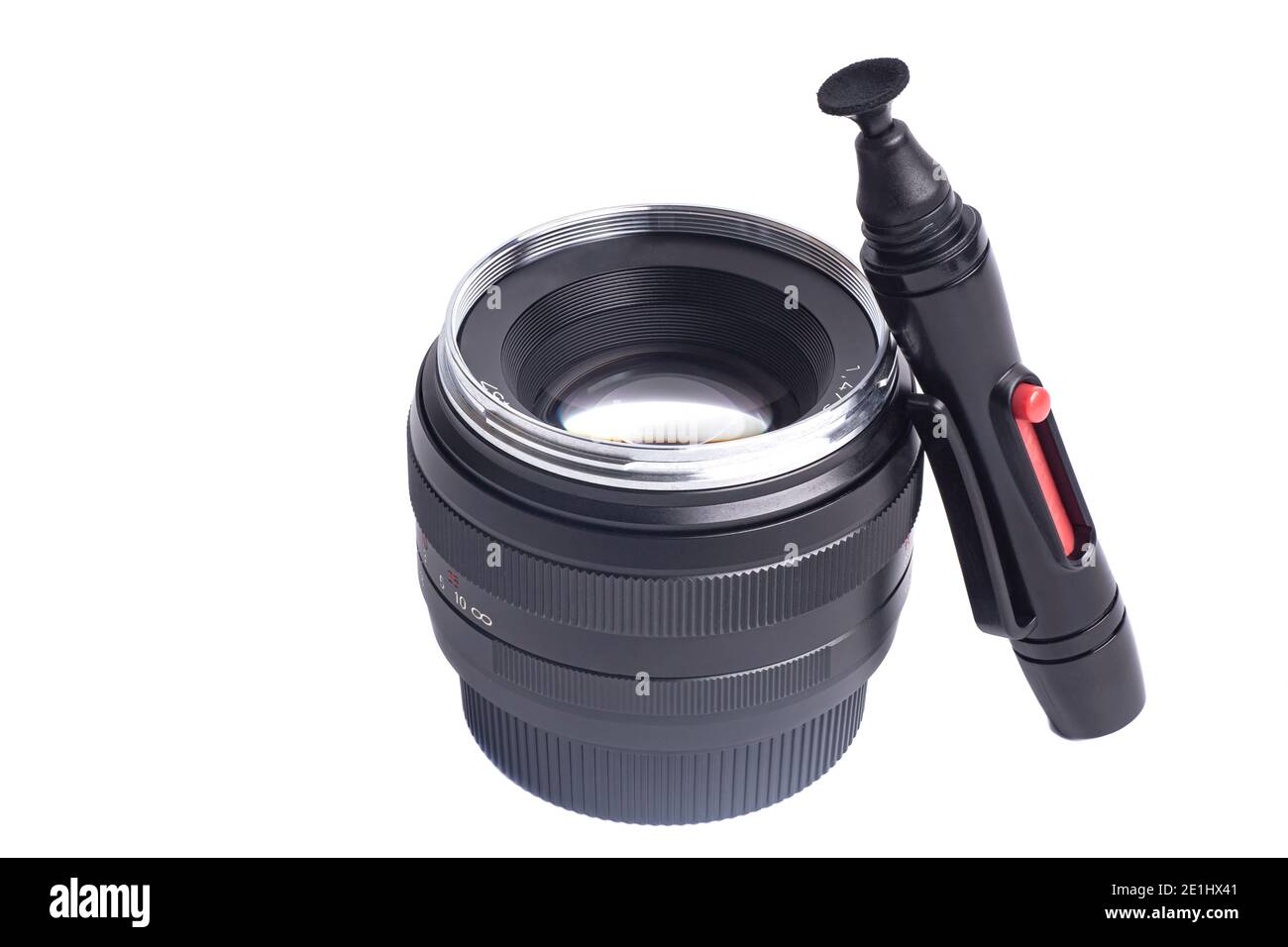 Camera lens and lens cleaner pen Isolated on a white background Stock