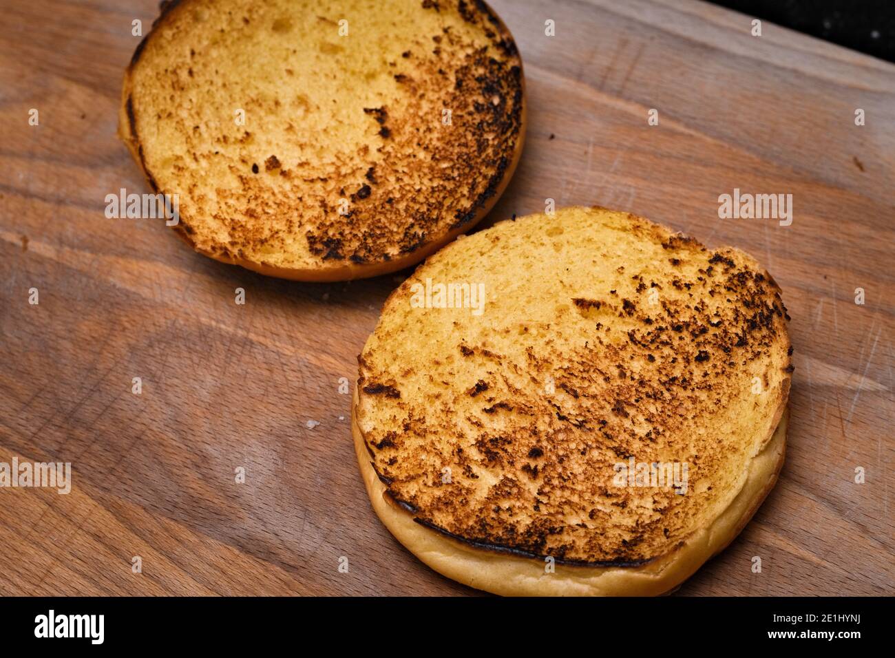 Brioche bun freshly toasted on a pan Stock Photo Alamy
