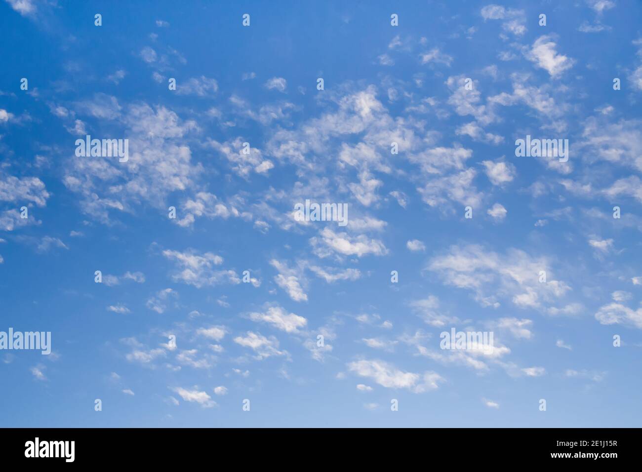 Blue clean sky with white picturesque clouds background Stock Photo - Alamy