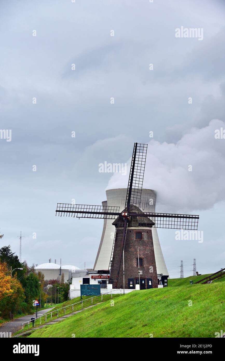Power plant Windmill in front of Doel Nuclear Power Station Stock Photo