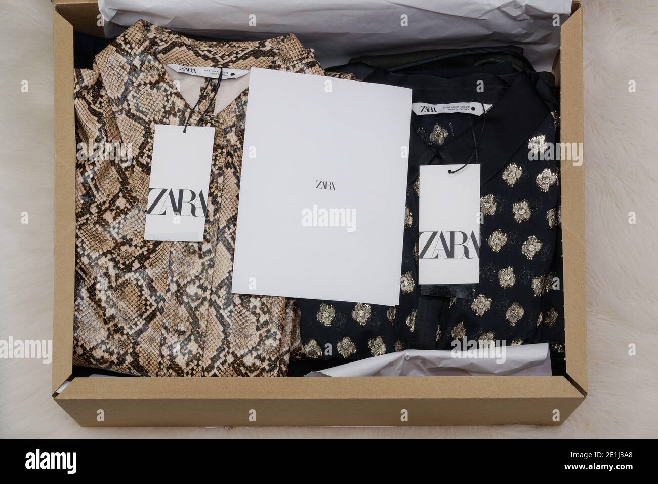 Zara Spanish clothes brand online delivery box. Open carton order package  containing Inditex retailer wearables with company logo Stock Photo - Alamy