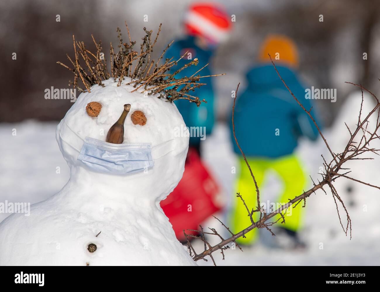 Snowman with a banana mouth hi-res stock photography and