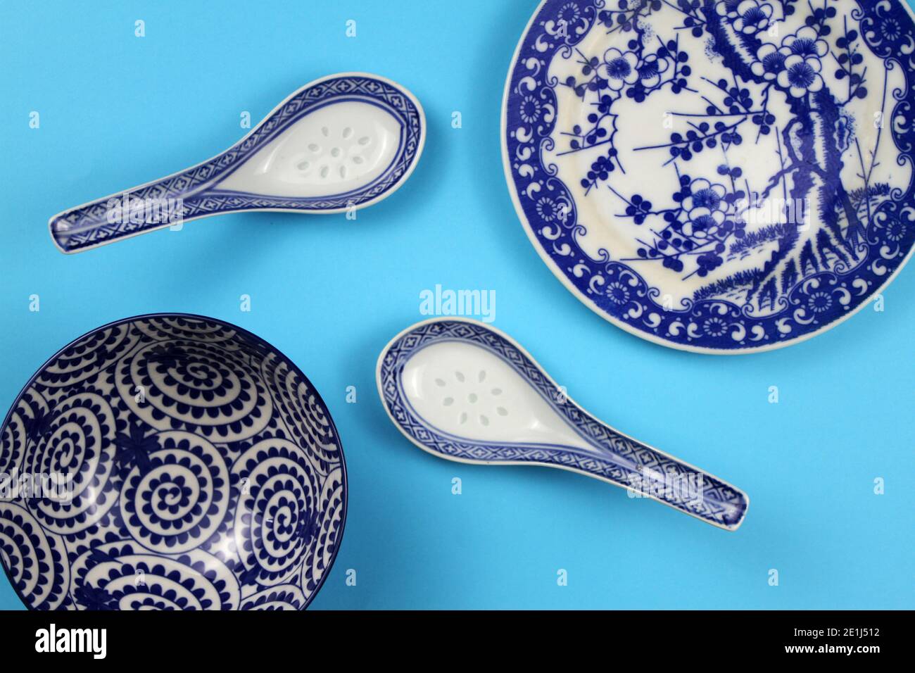 A selection of blue Asianstyle crockery against a plain background