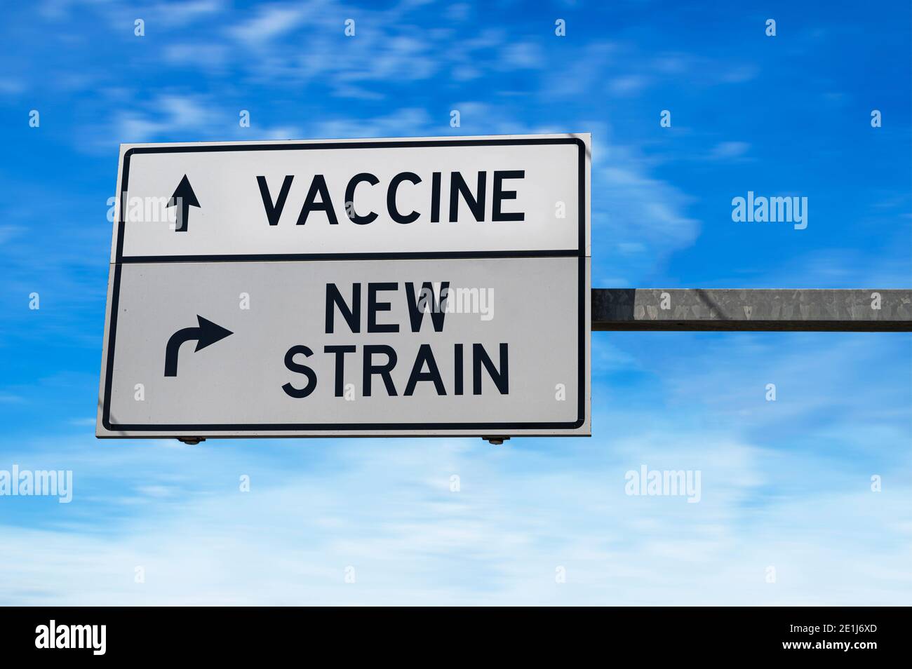 Road sign with words vaccine and new strain. White two street signs with arrow on metal pole. Stock Photo