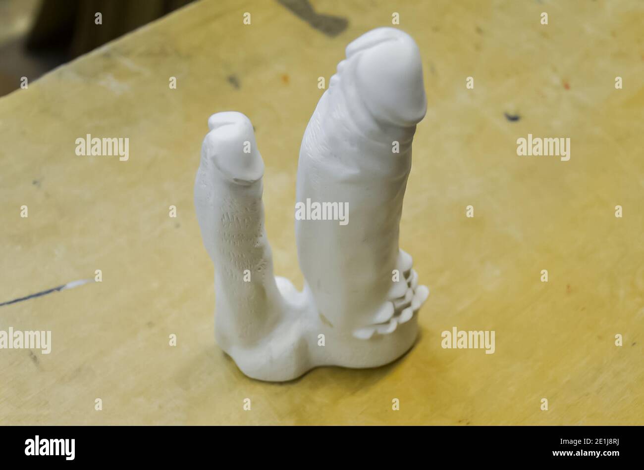 Processing of rubber products for sex shop on the machine. Mold for the  product. Rubber penis Stock Photo - Alamy