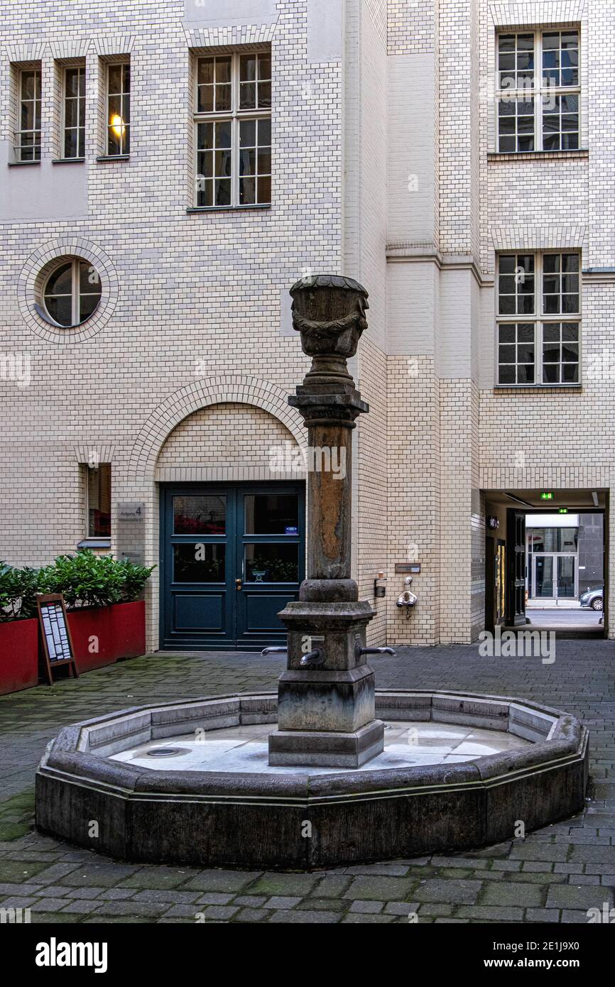 Fountain in inner yard of Kaiserhöfe building built 1912-14 in Unter den Linden, Mitte, Berlin Stock Photo