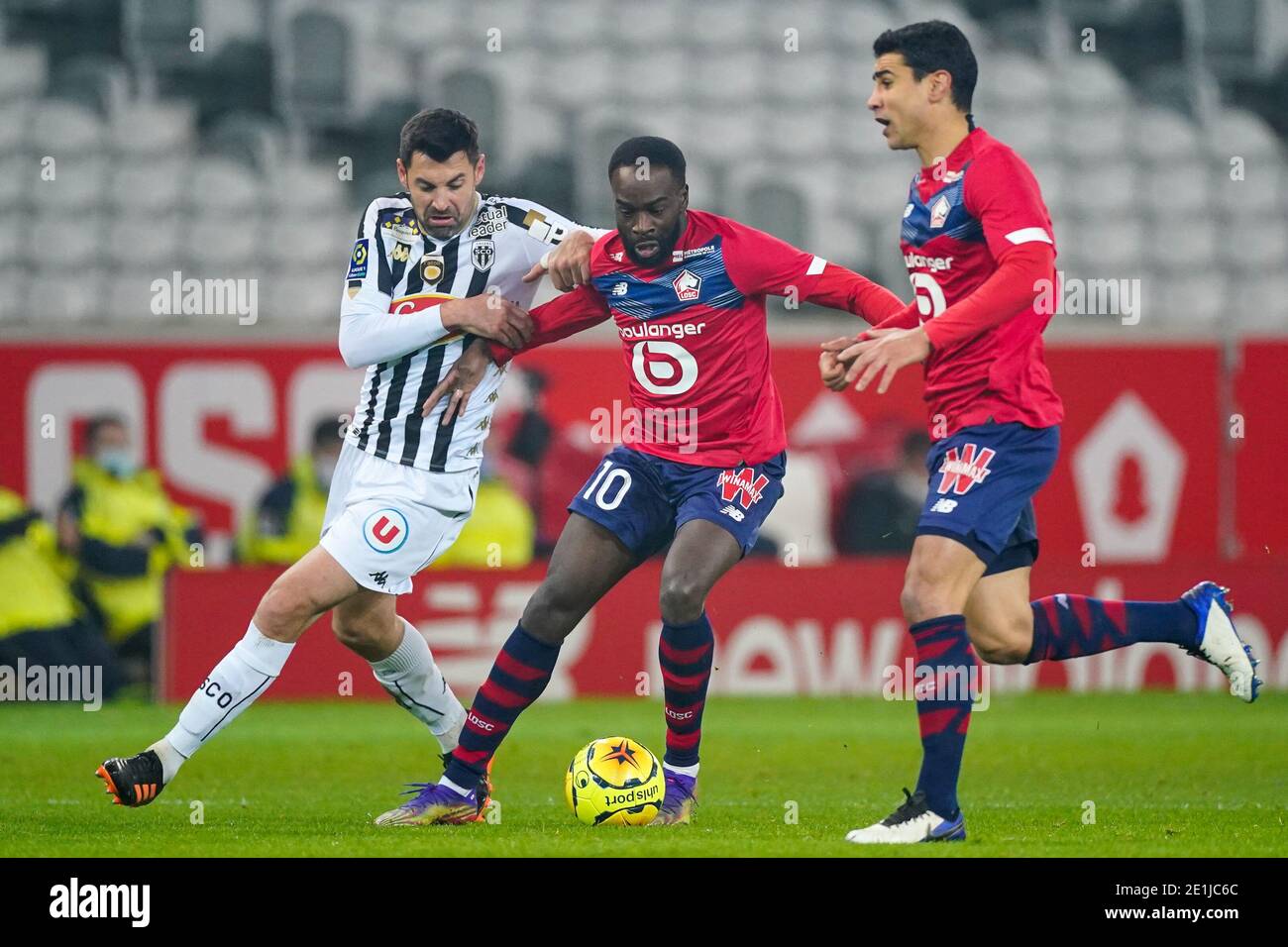 LILLE, FRANCE - JANUARY 6: Thomas Mangani of Angers SCO, Jonathan Ikone of Lille OSC during the Ligue 1 match between Lille OSC and Angers SCO at Stad Stock Photo