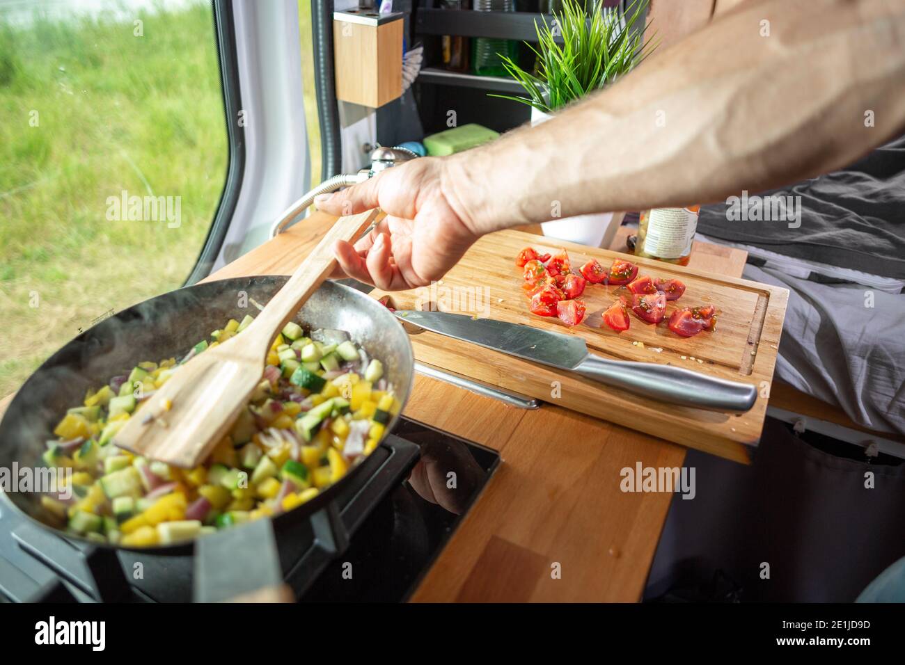 Cooking food inside a caravan Stock Photo