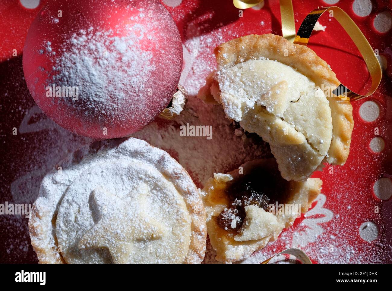 christmas mince pies, red bauble and gold tinsel Stock Photo