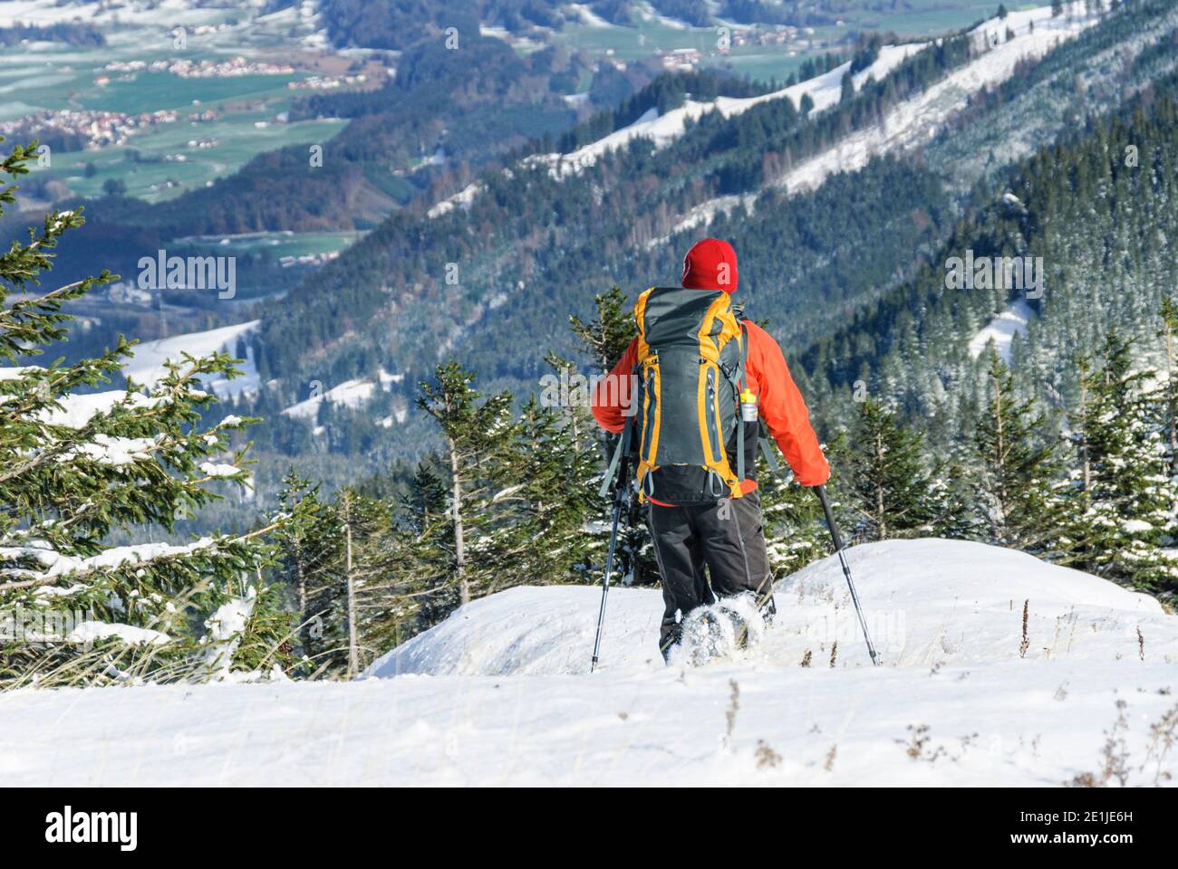 Hikers descending from mountain top Stock Photo
