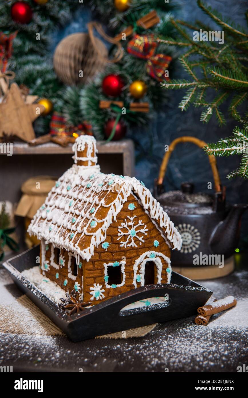 festive christmas styling of homemade gingerbread house decorated with sugar snowflakes stock photo alamy