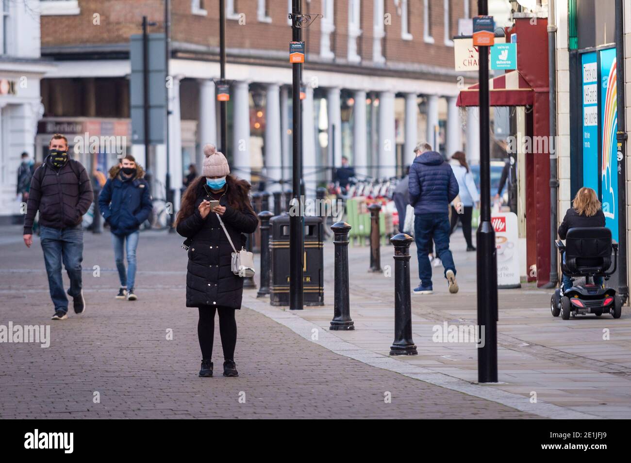 Uxbridge, UK.  7 January 2021. People in the high street in Uxbridge, north west London, on the morning that the third national lockdown came in to effect.  The UK government has imposed tougher restrictions in an effort to combat a recently discovered variant strain as the number of Covid-19 related deaths and coronavirus cases continues to increase.  Boris Johnson, Prime Minister, is MP for the constituency of Uxbridge and South Ruislip.  Credit: Stephen Chung / Alamy Live News Stock Photo