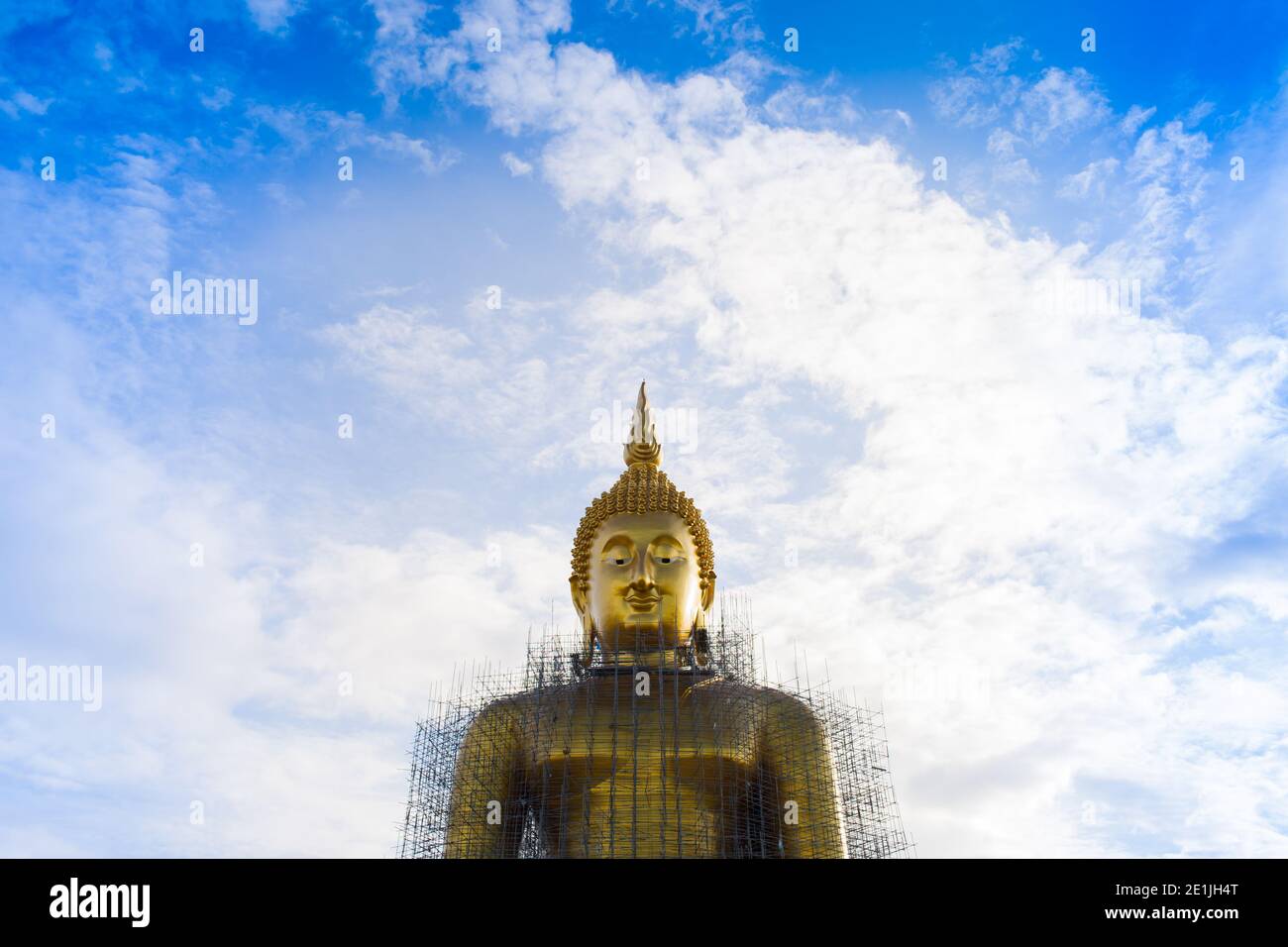 Golden Buddha with clear sky background Stock Photo - Alamy