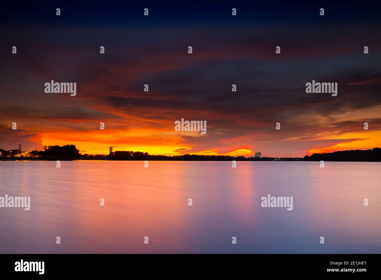 Silhouette sunset reflection on water in dam Stock Photo - Alamy