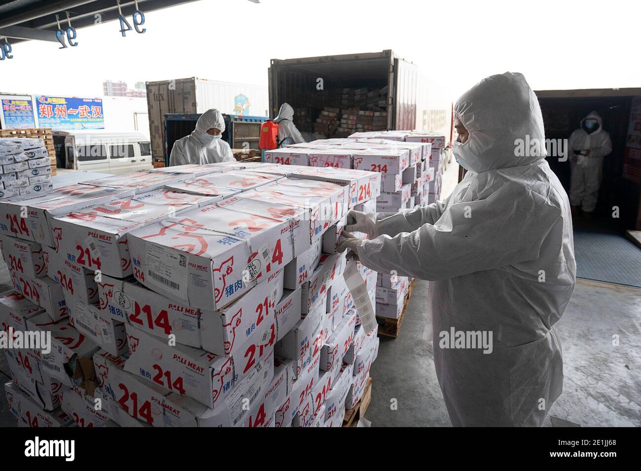 Wuhan, China's Hubei Province. 7th Jan, 2021. Staff members paste QR codes on imported cold chain food for traceable management at a regional cold chain center in Wuhan, capital of central China's Hubei Province, Jan. 7, 2021. Credit: Xiong Qi/Xinhua/Alamy Live News Stock Photo