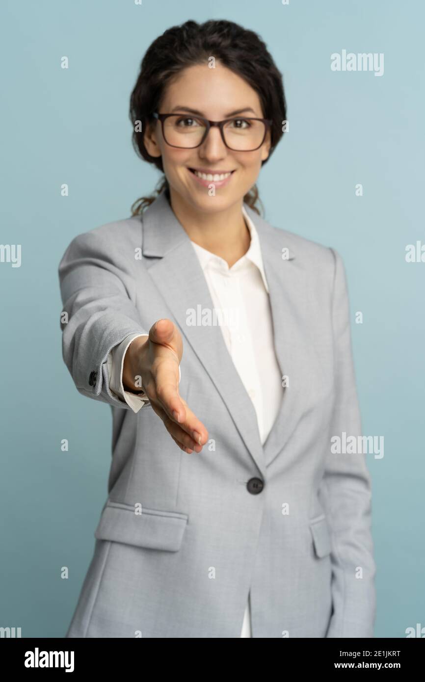 friendly hospitable cheerful business woman or office worker wear