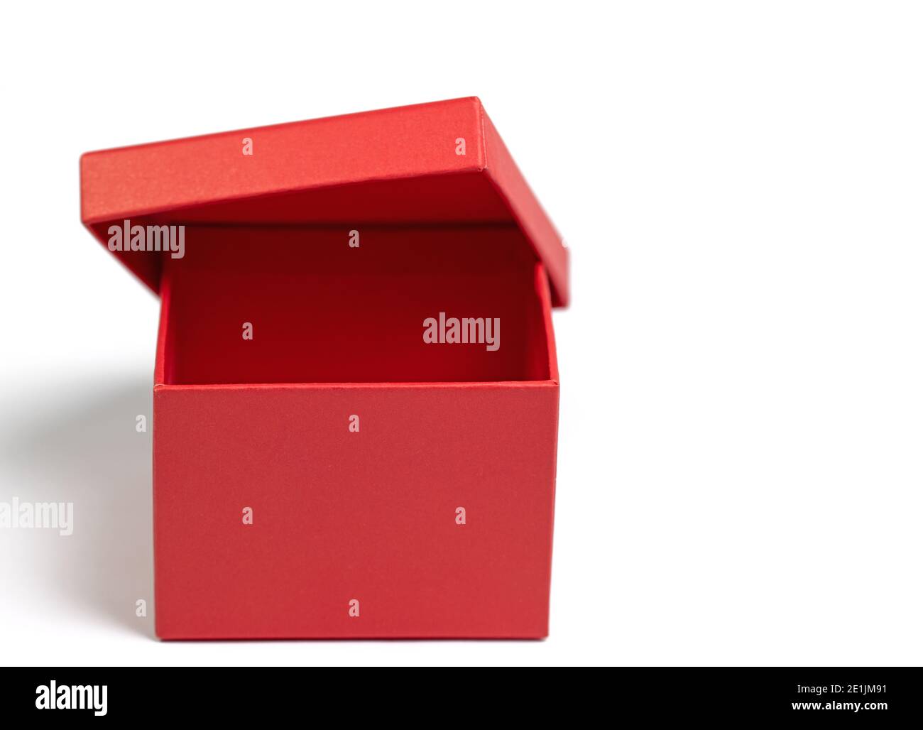Empty red cardboard box against white background Stock Photo