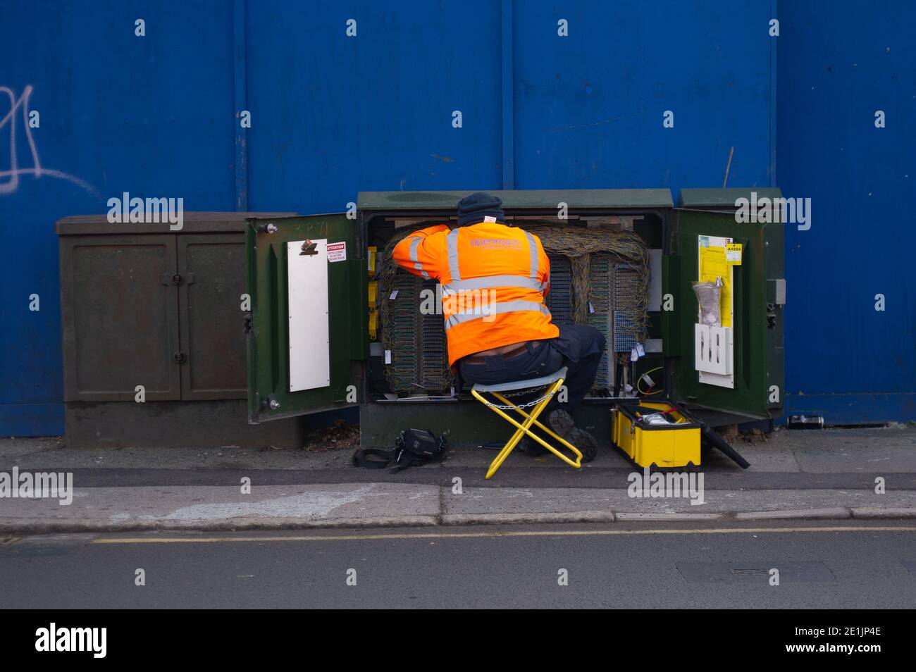 Slough, Berkshire, UK. 7th January, 2021. A BT Openreach key worker engineer at work. The number of positive Covid-19 cases in Slough is spiralling out of control. For the seven days up to 2 January 2021 the figures per 100,000 for Slough were 1064.6 up from 722.2. The average figure across England is only 606.9 for the same period. Credit: Maureen McLean/Alamy Stock Photo