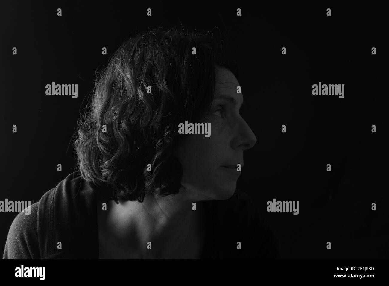 dark portrait of a woman Stock Photo