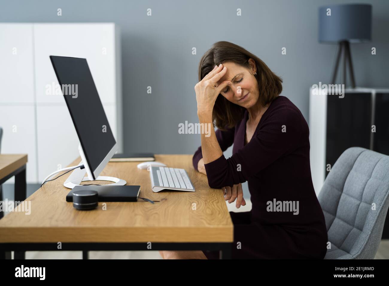 Stressed Upset Business Employee Woman At Work Stock Photo