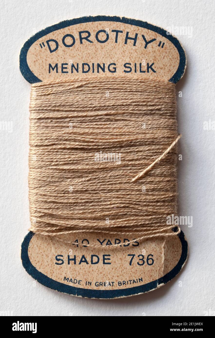 ball thread cotton darning yarn silk sewing needle sew stitch unite shelter  repair mend darn patch vertical clew Stock Photo - Alamy