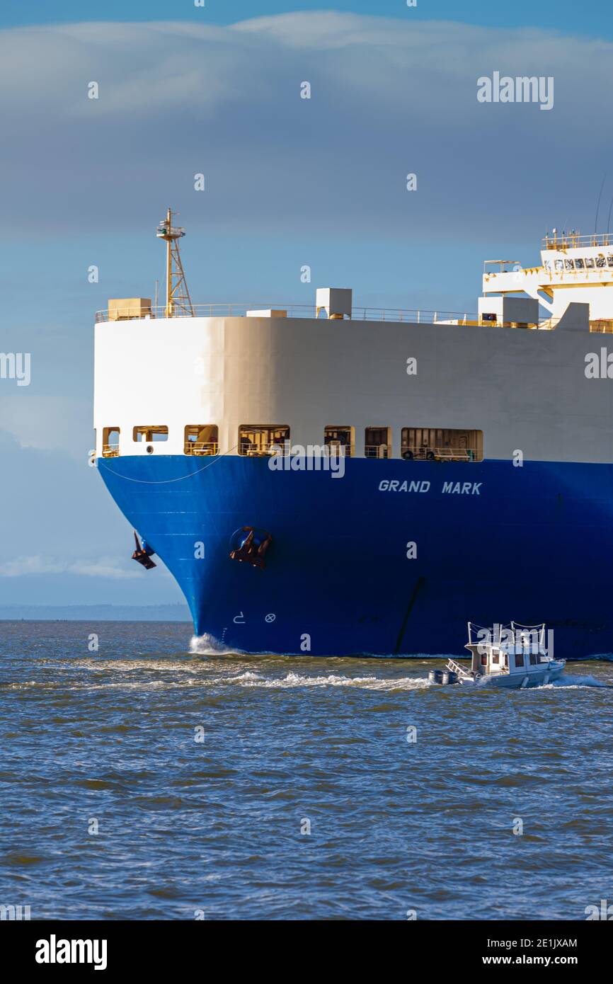.A large vehicle transport ship arriving along the Steveston waterfront from Asia, British Columbia Canada Stock Photo