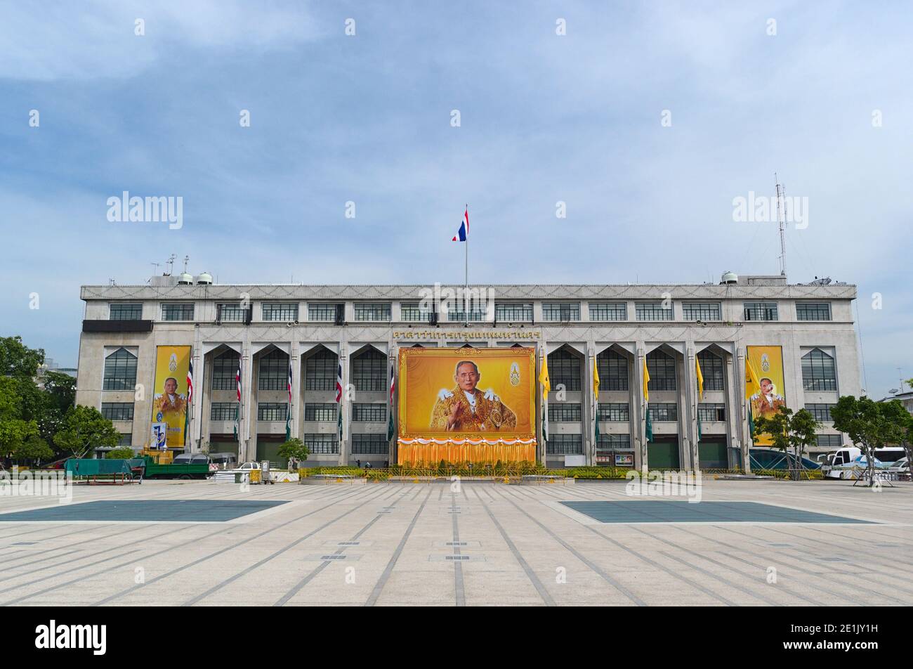 Bangkok, Thailand, December, 2015: Larn Kon Mueng square and view to building with large portrait of Thai King Bhumibol Adulyadej the Great (Rama IX) Stock Photo