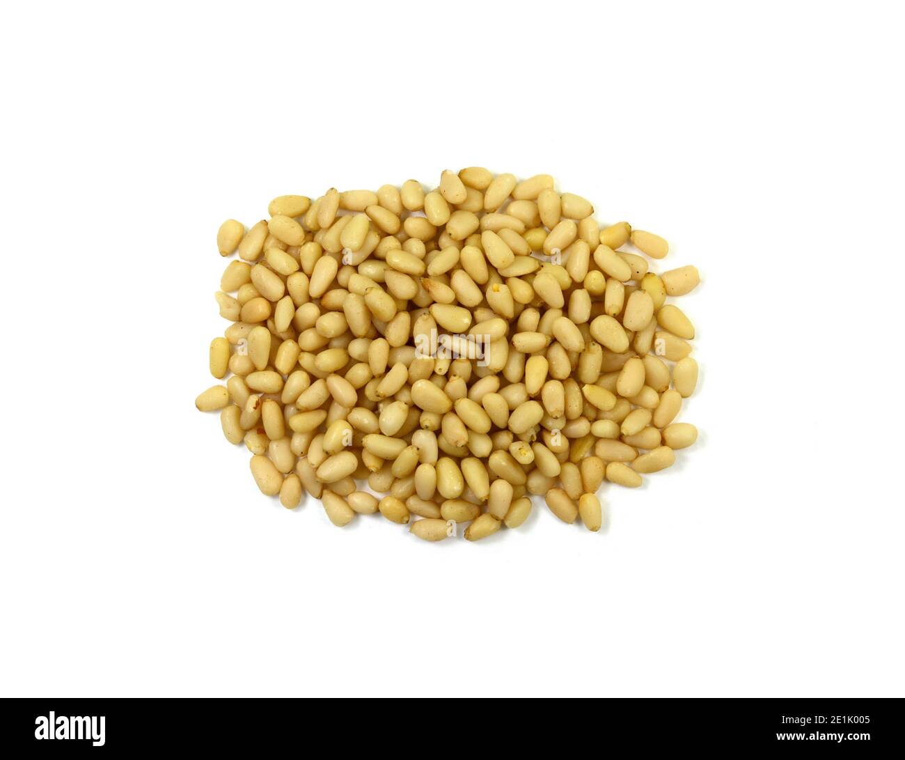 peeled pine nuts isolated on a white background Stock Photo