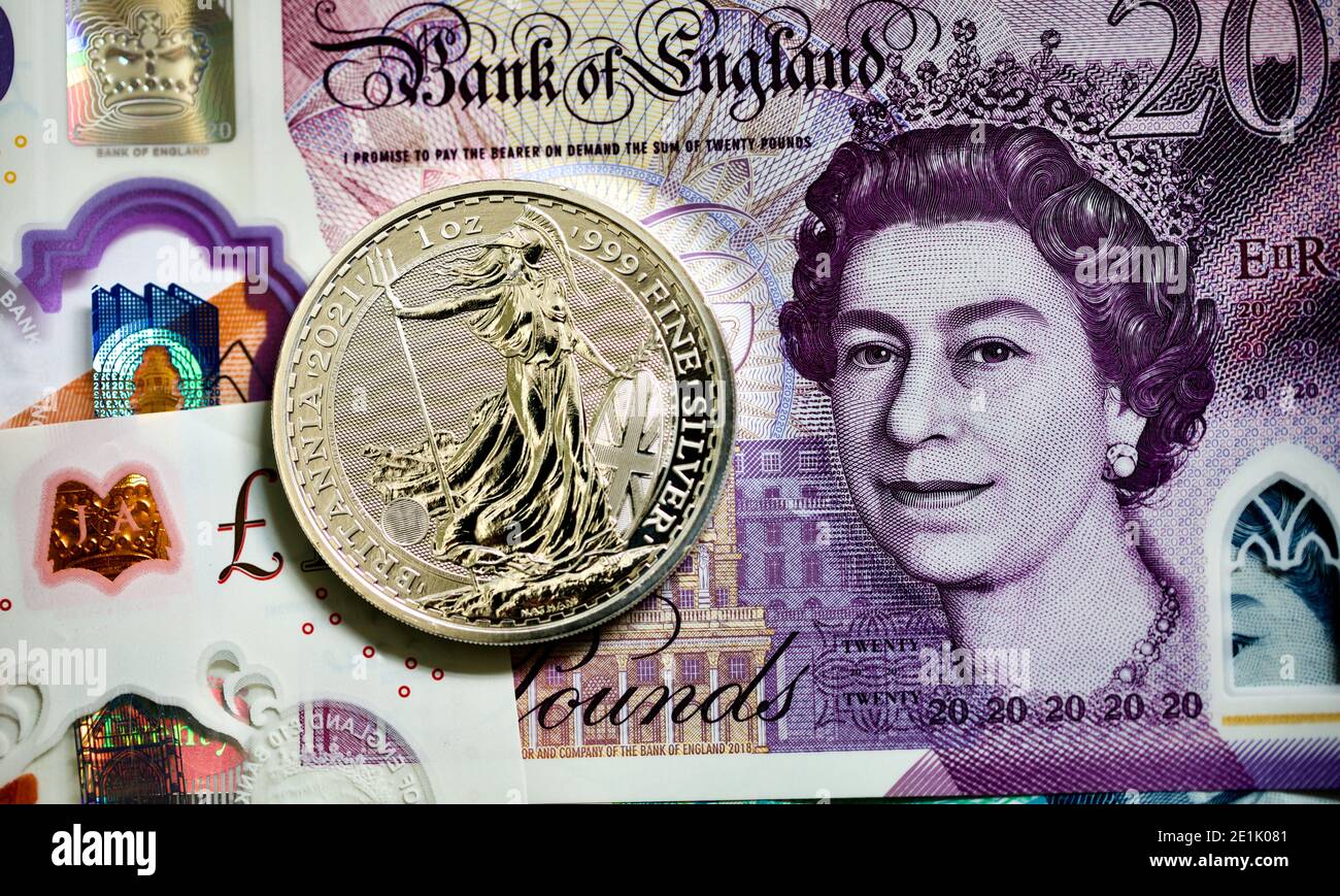 2021 Britannia One Ounce Silver Coin on the new polymer banknotes Stock Photo