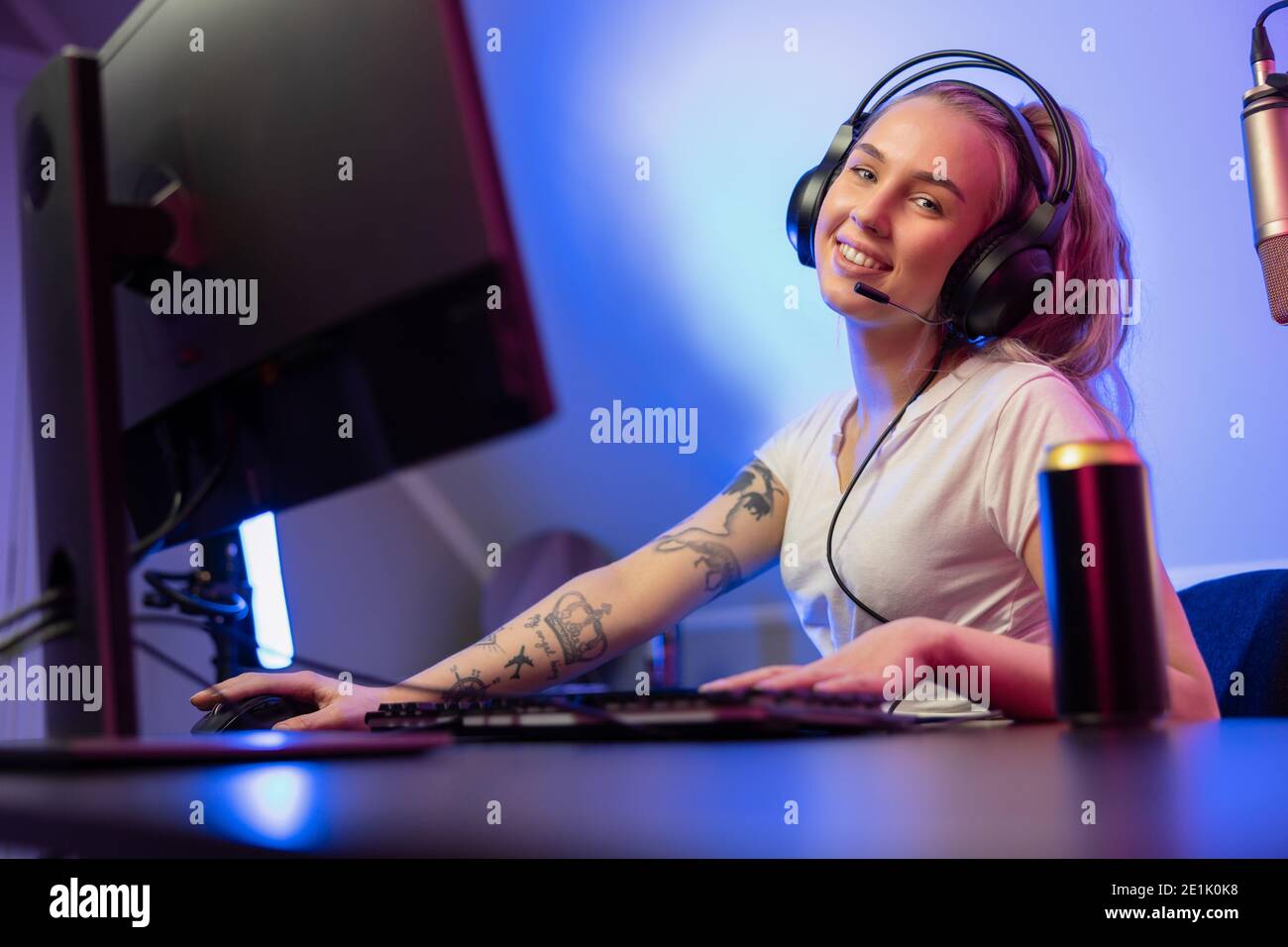 Happy Pretty Blonde Gamer Girl Playing Online Video Game on Her Personal  Computer Stock Photo - Alamy